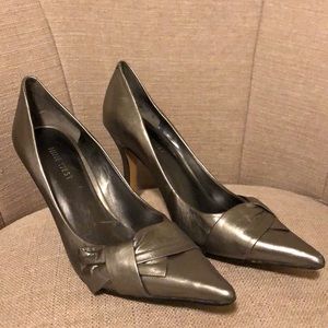 Nine West metallic pointed toed heels.